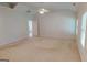 This large room offers bright lighting, neutral tones, and large windows for plenty of natural light at 1461 Hada Ln, Lawrenceville, GA 30043