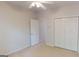 Bedroom featuring a closet, door to another room, and neutral decor, perfect for personalization at 1461 Hada Ln, Lawrenceville, GA 30043