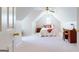 Bright bedroom with sloped ceilings featuring a twin bed, desk, and natural light at 1461 Hada Ln, Lawrenceville, GA 30043