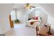 Bedroom with sloped ceilings featuring a twin bed, desk, and natural light at 1461 Hada Ln, Lawrenceville, GA 30043