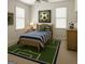Bright bedroom featuring a twin bed, soccer-themed decor, and natural light from the windows at 1461 Hada Ln, Lawrenceville, GA 30043