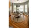 Cozy dining area with circular rug, modern table, and lots of natural light at 1461 Hada Ln, Lawrenceville, GA 30043