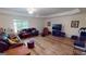 Large living room featuring recessed lighting, hardwood floors, and a view of the backyard at 1461 Hada Ln, Lawrenceville, GA 30043