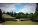 Beautiful outdoor pool area with a covered lounge area and plenty of seating at 1461 Hada Ln, Lawrenceville, GA 30043