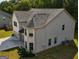 Rear aerial view of home highlighting the roof, siding, and landscaping at 161 Jodi Pl, Locust Grove, GA 30248