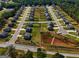 Aerial view of a well planned and established community surrounded by trees at 161 Jodi Pl, Locust Grove, GA 30248
