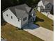 Aerial view of home with well-maintained lawn, driveway, and two-car garage at 161 Jodi Pl, Locust Grove, GA 30248