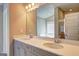 Bathroom features double vanity with white quartz counters, neutral paint, and carpeted floor at 161 Jodi Pl, Locust Grove, GA 30248