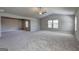 Very spacious bedroom with vaulted ceiling, carpeted floors, windows, and neutral paint at 161 Jodi Pl, Locust Grove, GA 30248
