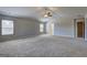 Spacious bedroom with natural light, neutral paint, and carpeted floors at 161 Jodi Pl, Locust Grove, GA 30248