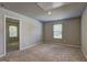 Spacious bedroom with neutral walls, carpeted floors, and natural light from one window at 161 Jodi Pl, Locust Grove, GA 30248