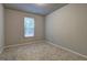 Bedroom with carpeted floors and a single window at 161 Jodi Pl, Locust Grove, GA 30248