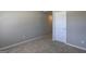 Neutral bedroom featuring carpet flooring with a door and base trim at 161 Jodi Pl, Locust Grove, GA 30248
