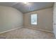 Neutral bedroom with carpet flooring, a window with blinds, and a peaked ceiling at 161 Jodi Pl, Locust Grove, GA 30248