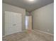 Bedroom featuring neutral walls, carpeted floors, and double door closet at 161 Jodi Pl, Locust Grove, GA 30248