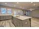 Modern kitchen featuring an island with a sink and ample countertop space at 161 Jodi Pl, Locust Grove, GA 30248