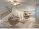 Open-concept living room showcasing modern finishes and seamless flow into a spacious kitchen at 161 Jodi Pl, Locust Grove, GA 30248