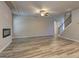 Open living room space with a modern fireplace and staircase leading to the upper level at 161 Jodi Pl, Locust Grove, GA 30248