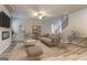 Inviting living room featuring stylish decor, a fireplace, and an open staircase at 161 Jodi Pl, Locust Grove, GA 30248