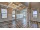Inviting living space featuring a coffered ceiling, elegant chandelier, and light gray flooring at 161 Jodi Pl, Locust Grove, GA 30248