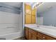Bathroom featuring a shower and vanity sink with wood cabinets at 125 Laney Ct, Mcdonough, GA 30252
