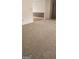 Spacious living room with neutral carpet and an open layout to the dining area at 125 Laney Ct, Mcdonough, GA 30252