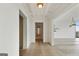 Bright hallway featuring hardwood floors, recessed lighting, and an open floor plan connecting living spaces at 3630 Peachtree Rd # Ph3302, Atlanta, GA 30326