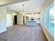 Open concept living room with view of the kitchen island and the outdoor deck at 217 Point Ridge Ct, Temple, GA 30179