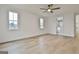 Bedroom with hardwood floors, ceiling fan, and attached bath at 150 Dockside Dr # 382, Fayetteville, GA 30215