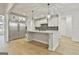 Modern kitchen boasts a large island and white cabinetry at 150 Dockside Dr # 382, Fayetteville, GA 30215