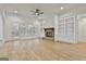 Living room with hardwood floors, fireplace, and built-in shelving at 150 Dockside Dr # 382, Fayetteville, GA 30215