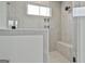 Modern shower with gray tile and built-in seat at 150 Dockside Dr # 382, Fayetteville, GA 30215