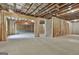 Unfinished basement with open floor plan, framing, and exposed beams at 150 Dockside Dr # 382, Fayetteville, GA 30215