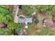 Aerial view of a home with a gray roof surrounded by green trees and a well-maintained yard at 470 Dix Lee On Dr, Fayetteville, GA 30214