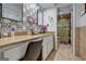 Bathroom featuring a marble countertop, decorative mirror, and a shower with a glass door at 470 Dix Lee On Dr, Fayetteville, GA 30214