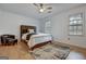 Bright bedroom featuring a bed, with a white comforter, a ceiling fan, and natural light at 470 Dix Lee On Dr, Fayetteville, GA 30214