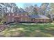 Traditional two-story brick home with a well-manicured lawn and mature landscaping at 470 Dix Lee On Dr, Fayetteville, GA 30214