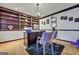 Stylish office area featuring built-in shelving, a sleek desk setup, and a modern chandelier above at 470 Dix Lee On Dr, Fayetteville, GA 30214