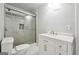 Well-lit bathroom with a glass-enclosed shower, tiled walls, and a single sink vanity at 3140 Jackson Creek Dr, Stockbridge, GA 30281