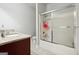 Bathroom with shower and tub combo featuring a tiled surround and glass doors at 3140 Jackson Creek Dr, Stockbridge, GA 30281