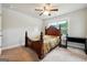 Bedroom with carpet flooring, a ceiling fan, a bed, and a window for natural light at 3140 Jackson Creek Dr, Stockbridge, GA 30281