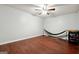 Bedroom with hardwood floors, ceiling fan, and a hammock for relaxing indoors at 3140 Jackson Creek Dr, Stockbridge, GA 30281
