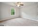 Cozy bedroom offers natural light from a window and a ceiling fan at 3140 Jackson Creek Dr, Stockbridge, GA 30281