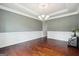 Elegant dining space featuring hardwood floors, wainscoting, decorative lighting, and neutral paint at 3140 Jackson Creek Dr, Stockbridge, GA 30281