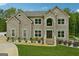 Stunning two-story brick home featuring manicured landscaping and a symmetrical facade at 3140 Jackson Creek Dr, Stockbridge, GA 30281