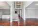 Grand foyer with gleaming hardwood floors and an impressive staircase with iron railings at 3140 Jackson Creek Dr, Stockbridge, GA 30281