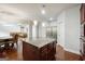 Kitchen island with granite countertop, pendant lighting and stainless steel refrigerator at 3140 Jackson Creek Dr, Stockbridge, GA 30281