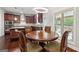 Eat-in kitchen boasts granite counters, modern lighting, and access to a porch at 3140 Jackson Creek Dr, Stockbridge, GA 30281