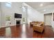 Bright and airy living room featuring hardwood floors, a fireplace, and large windows at 3140 Jackson Creek Dr, Stockbridge, GA 30281