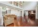 Open-concept living area featuring hardwood floors, a high ceiling, and easy access to the kitchen at 3140 Jackson Creek Dr, Stockbridge, GA 30281